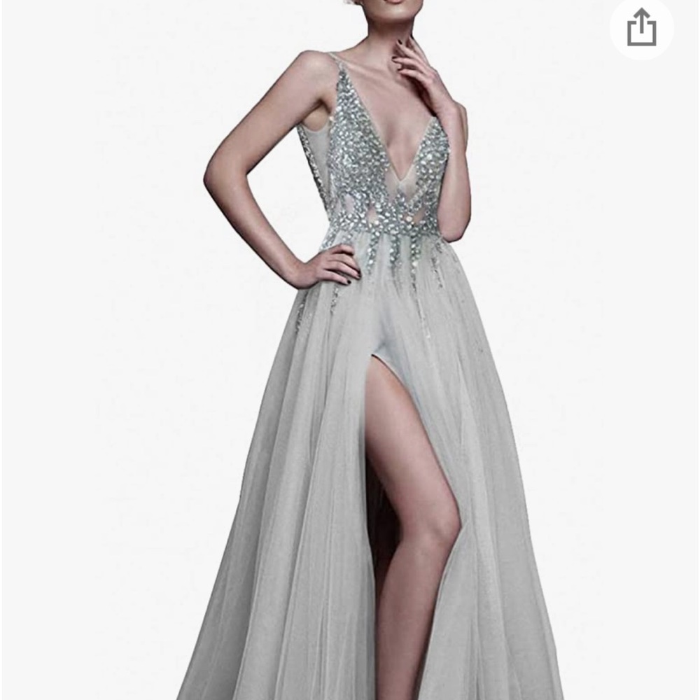 It’s a size 10 , grayish color with beautiful detail. Never worn